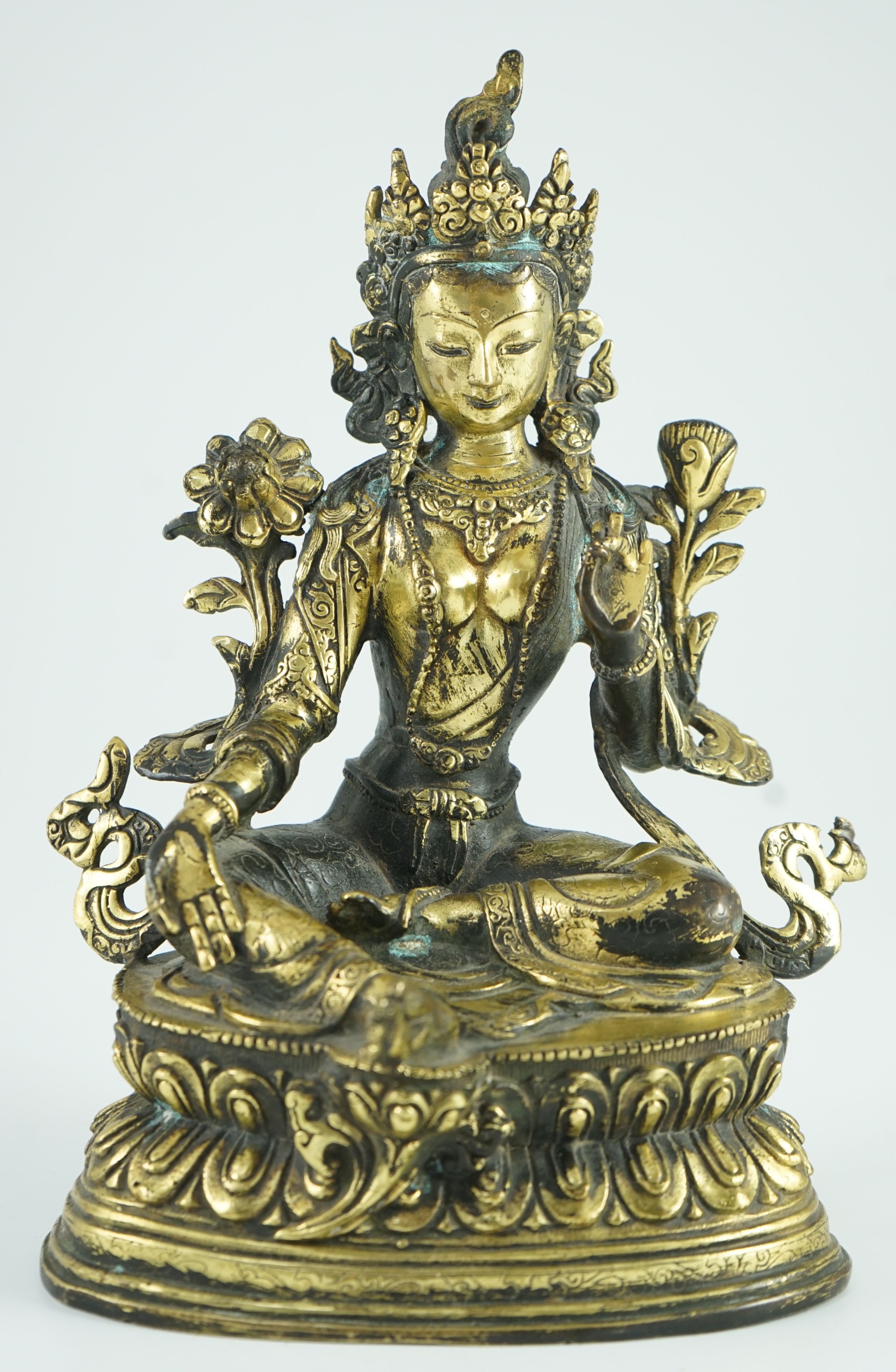 A Sino-Tibetan bronze seated figure of Green Tara, 23.5 cm high